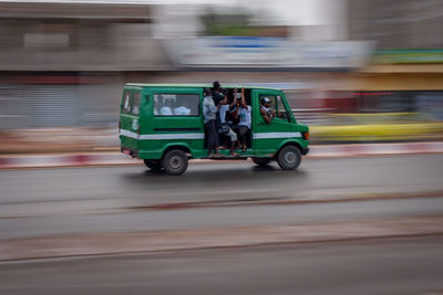 Blurred motion of car on road in city