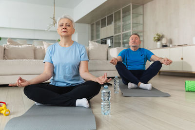 Portrait of senior man exercising at home