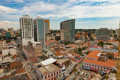 High angle view of buildings in city against sky