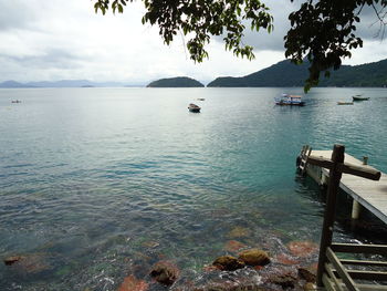 Boats moored in sea