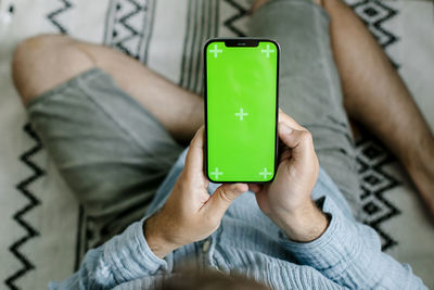 Midsection of woman using mobile phone