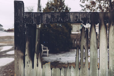 Close-up of wooden post in snow