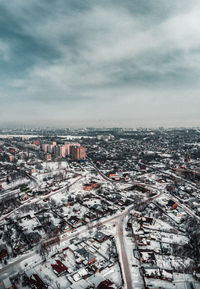 High angle view of city and buildings against sky. drone