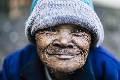 Close-up portrait of smiling man outdoors