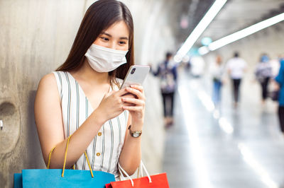 Young woman using mobile phone