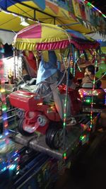 Full frame shot of illuminated lanterns hanging from car