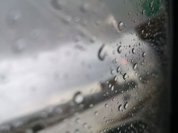 Close-up of raindrops on glass window
