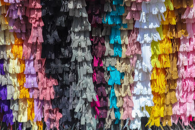 Full frame shot of multi colored umbrellas hanging at store