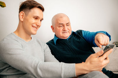 Portrait of young man using mobile phone