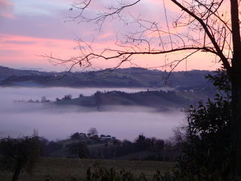 Scenic view of landscape against sky during sunset