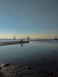 Scenic view of sea against sky at sunset