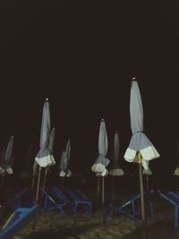 Chairs and tables on beach at night