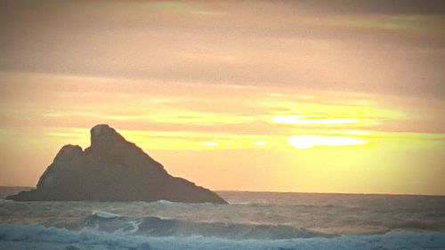 Scenic view of sea at sunset