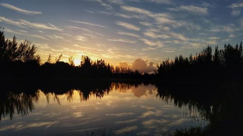 Scenic view of lake at sunset