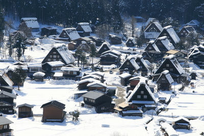 Snow covered houses in city