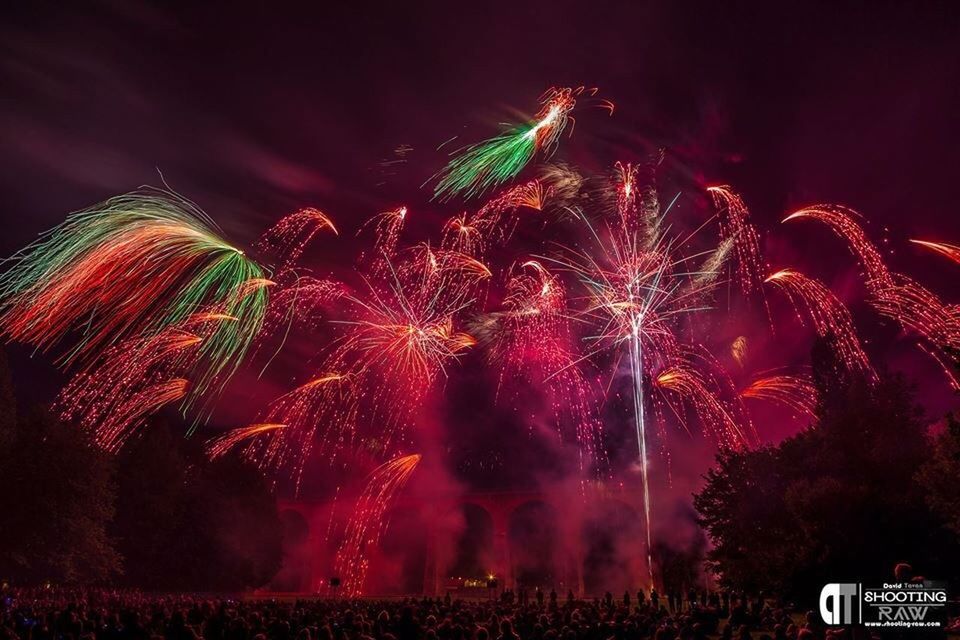 night, illuminated, firework display, celebration, long exposure, exploding, arts culture and entertainment, firework - man made object, event, sparks, motion, blurred motion, firework, sky, low angle view, glowing, multi colored, entertainment, celebration event, smoke - physical structure