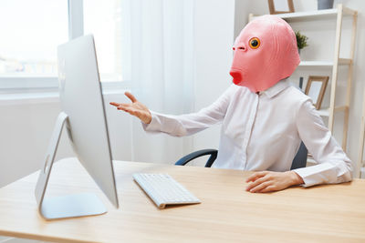 Midsection of woman working at table