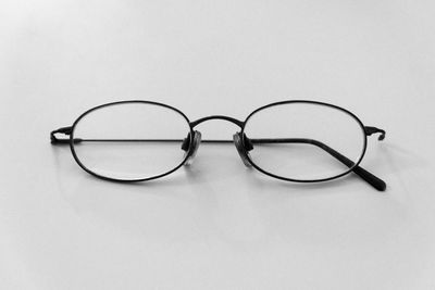 Close-up of eyeglasses against white background