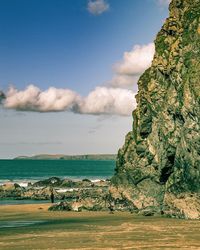 Scenic view of sea against cloudy sky