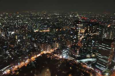 Aerial view of illuminated city at night