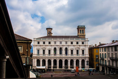 View of buildings against cloudy sky