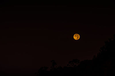 Scenic view of moon against clear sky at night