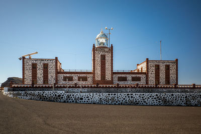 Low angle view of buildings against clear sky, lighthouse, fuerteventura 