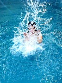 Portrait of man swimming in pool