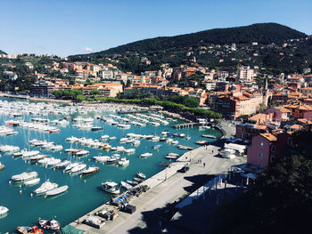 High angle view of harbor and buildings in city