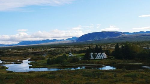 Scenic view of mountains and lake against sky