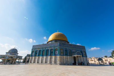 View of temple building against blue sky