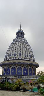 Low angle view of temple against building