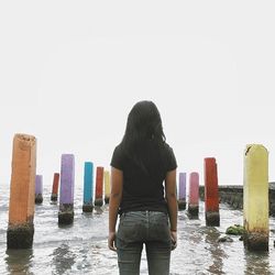 Man standing on pier