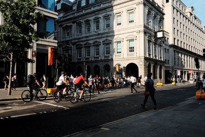 People on road in city