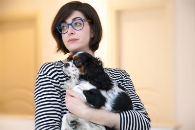 Portrait of woman wearing hat at home