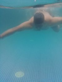 High angle view of man swimming in pool