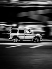 Side view of car parked on road