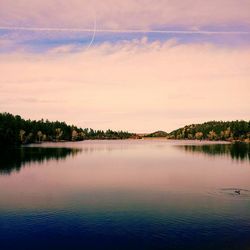 Scenic view of lake against sky during sunset