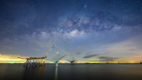 Scenic view of sea against sky at night