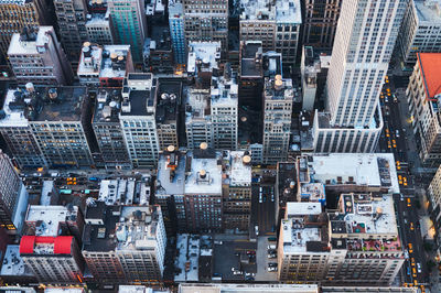 Horizontal shot of new york city rooftops from above at sunset
