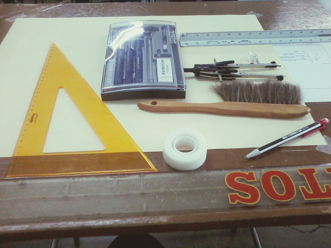 text, communication, western script, indoors, food and drink, close-up, high angle view, no people, table, sign, still life, information sign, yellow, day, guidance, wood - material, food, information, number, capital letter