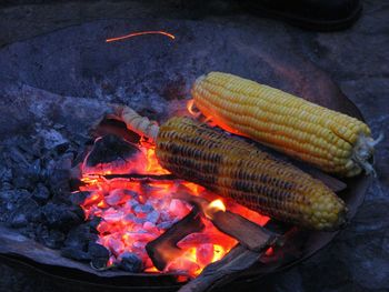 High angle view of sweet corn on barbecue grill