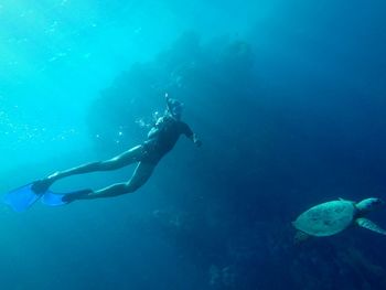 Young man snorkeling in sea