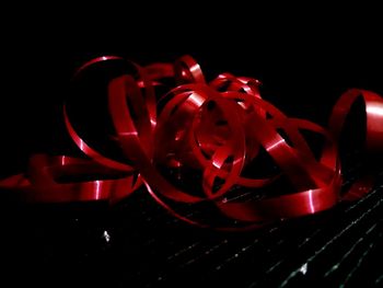 Close-up of red light painting in darkroom