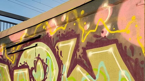Low angle view of graffiti on city