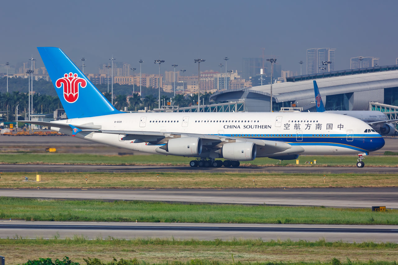 VIEW OF AIRPLANE AGAINST SKY