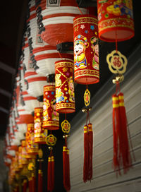 Low angle view of illuminated lanterns hanging in building