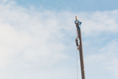 Low angle view of pole against sky