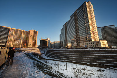 Low angle view of modern buildings against clear sky