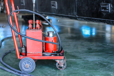 Red toy car against wall in city